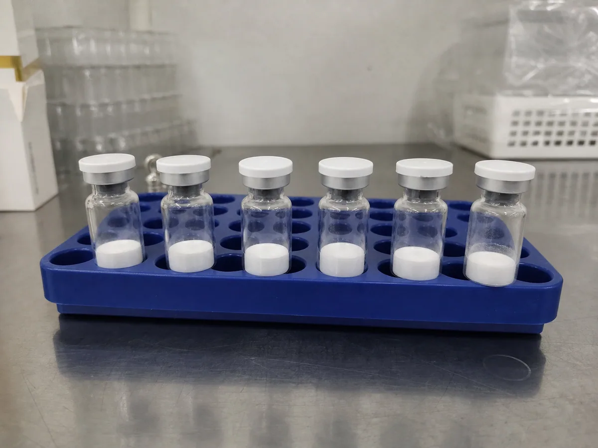 Unlabeled research vials arranged on a laboratory workbench